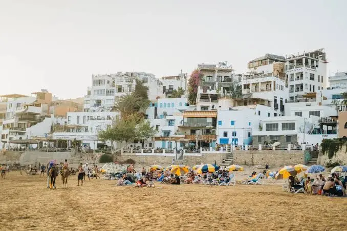 Taghazout's colorful hillside houses and surf beach
